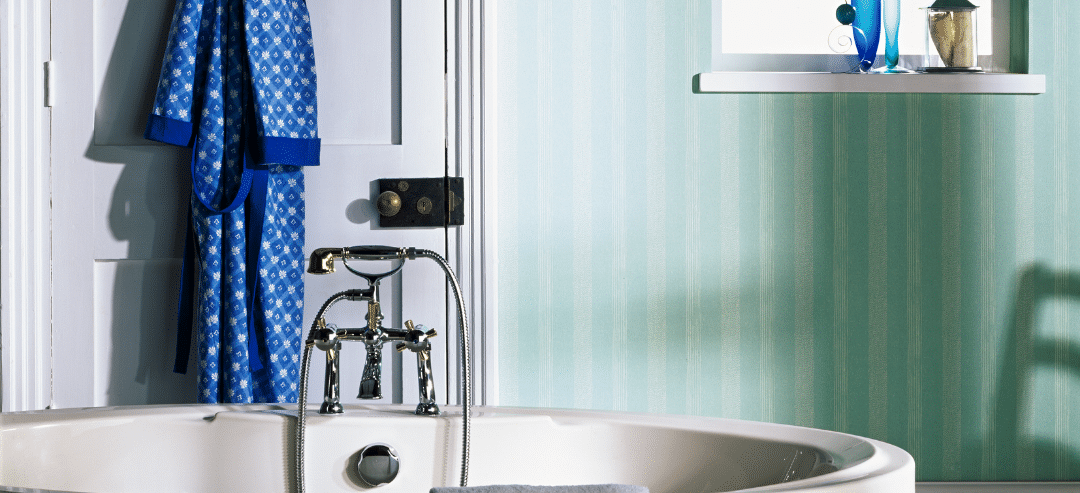 blue tub in a green and white bathroom