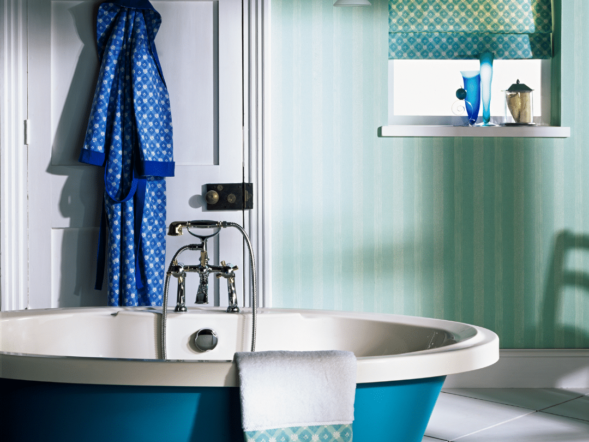 blue tub in a green and white bathroom