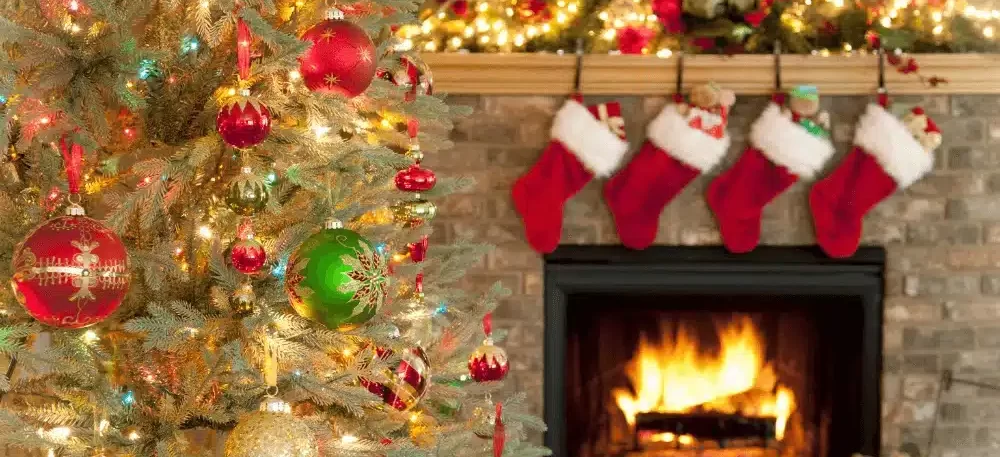 christmas tree and stockings hanging over the fire