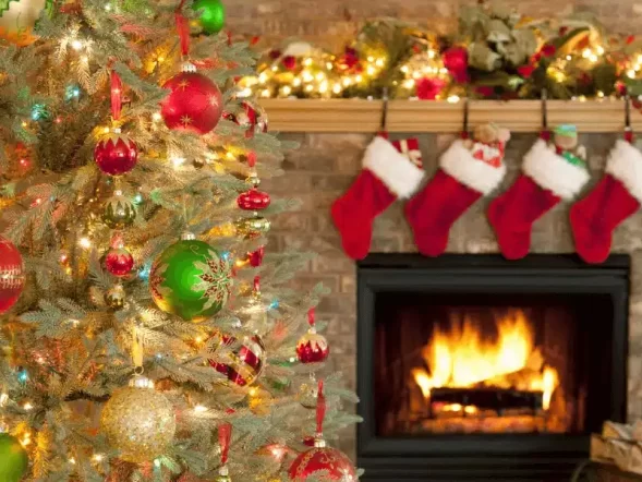 christmas tree and stockings hanging over the fire